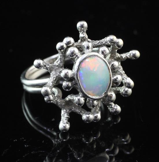 A 1970s 9ct white gold and white opal set free form ring by John Donald, size N.